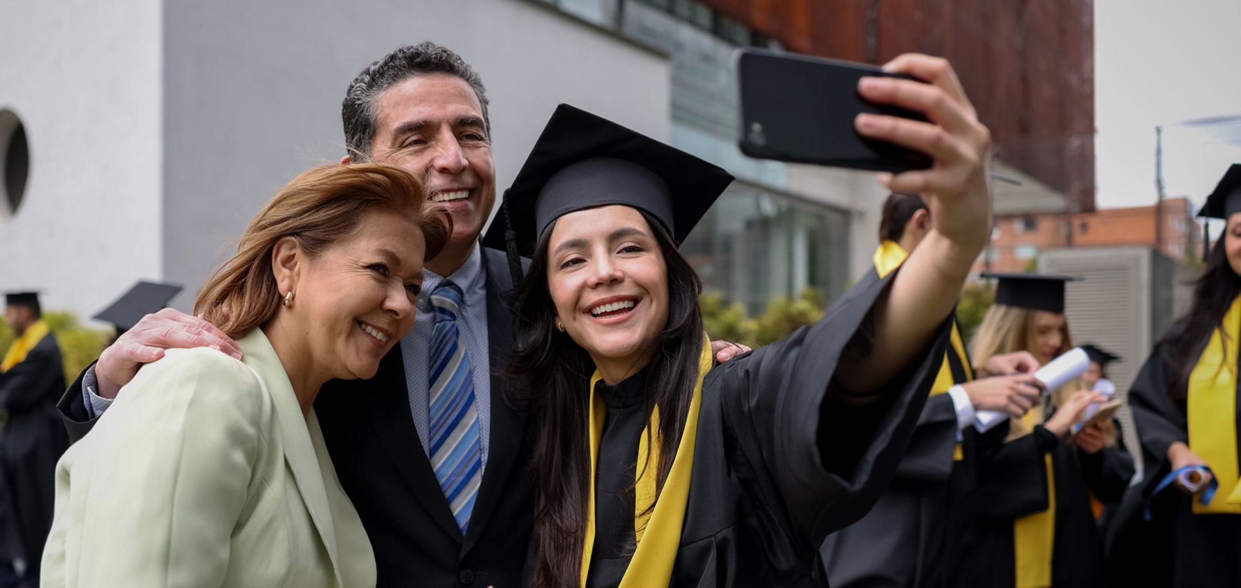 New Hampshire Mother, father and daughter celebrating daughters college graduation.